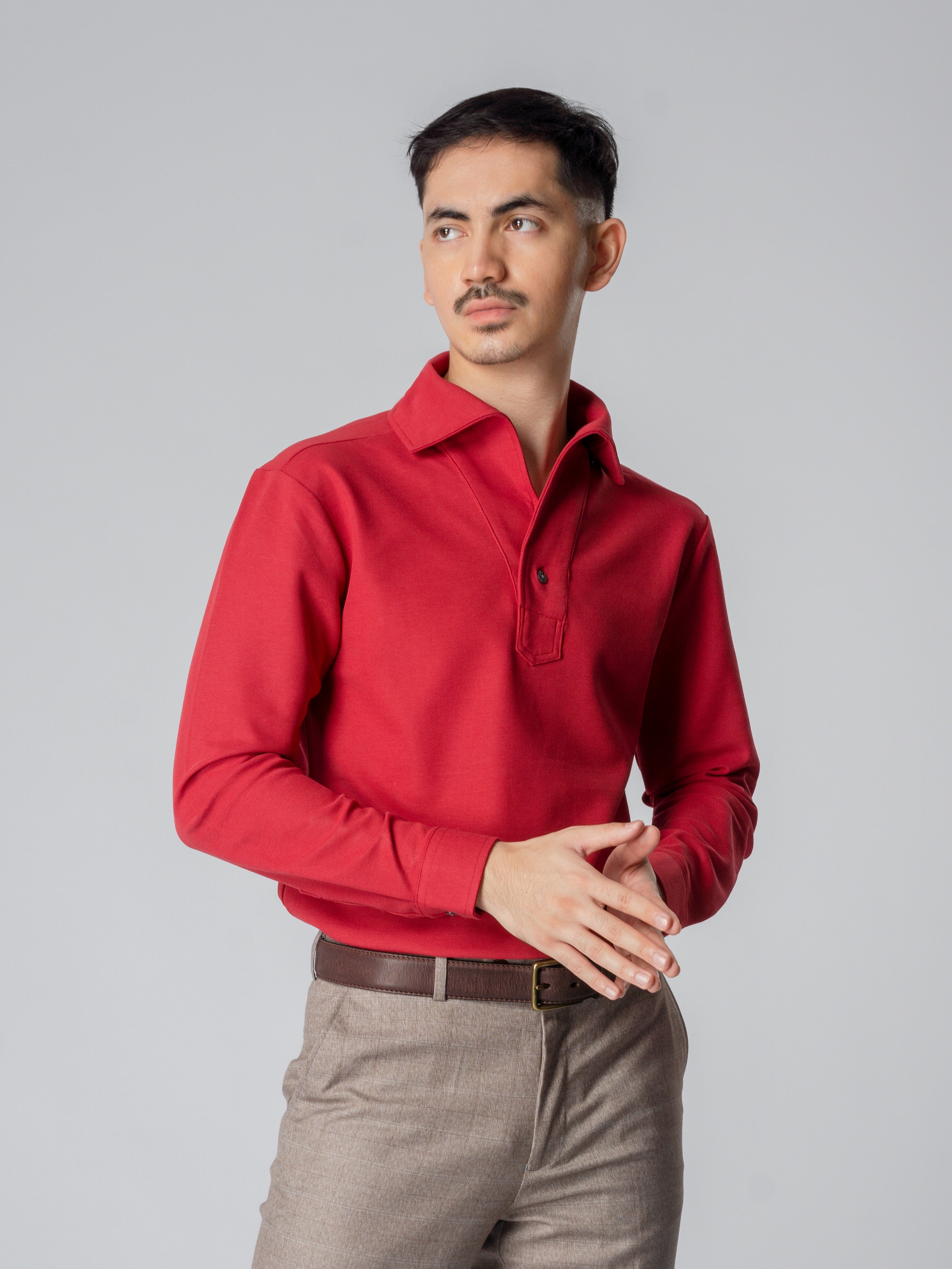 Red long sleeve polo shirt with one-piece collar and single button.