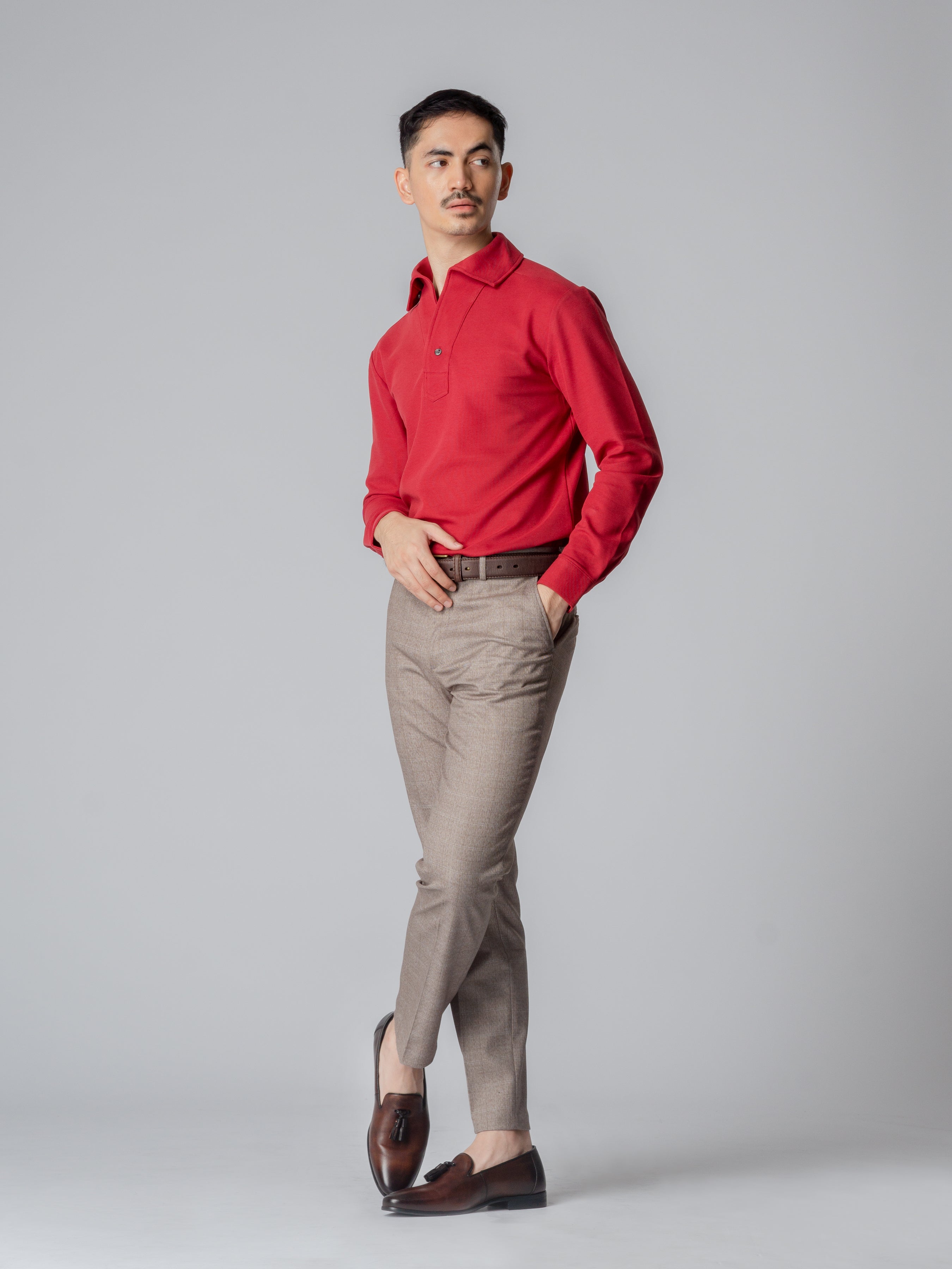 Red long sleeve polo shirt with one-piece collar and single button.