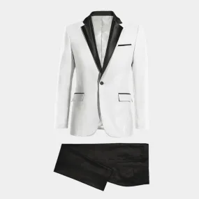 White broken blazer with essential black lapel and black pants.